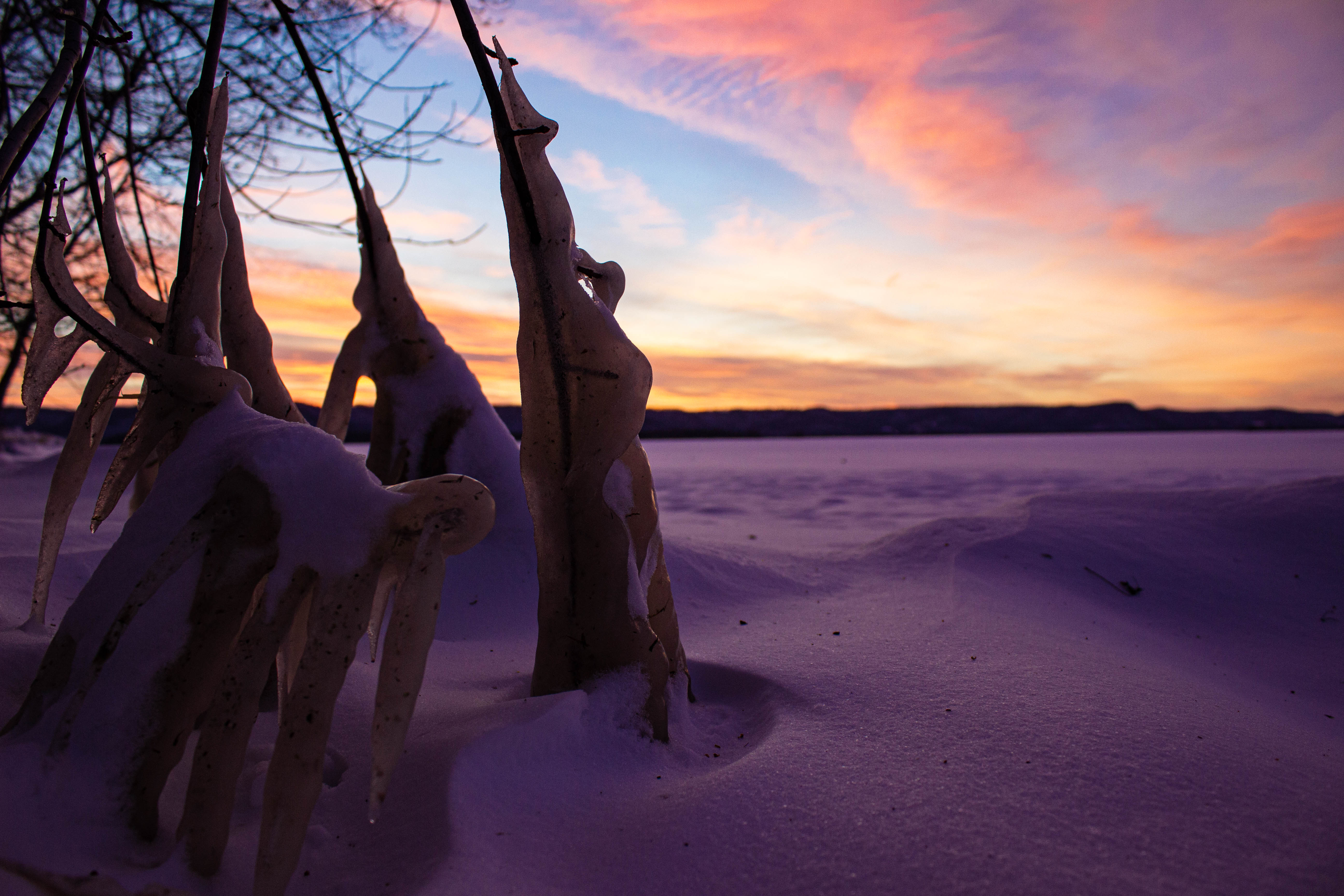 Snow-covered Lake Onalaska during a cold and beautiful evening sunset.